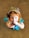 A happy child wearing a beautiful hair accessory from Ateliê Glamour Kids.