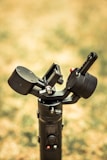 Close-up of a professional camera gimbal in motion during a dynamic shoot.