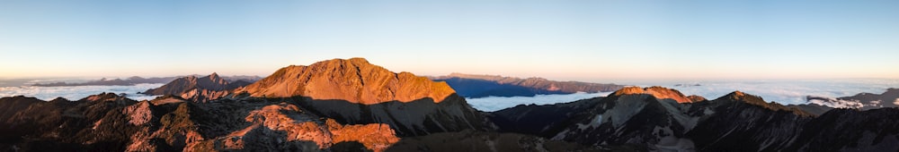 brown mountains under blue sky during daytime