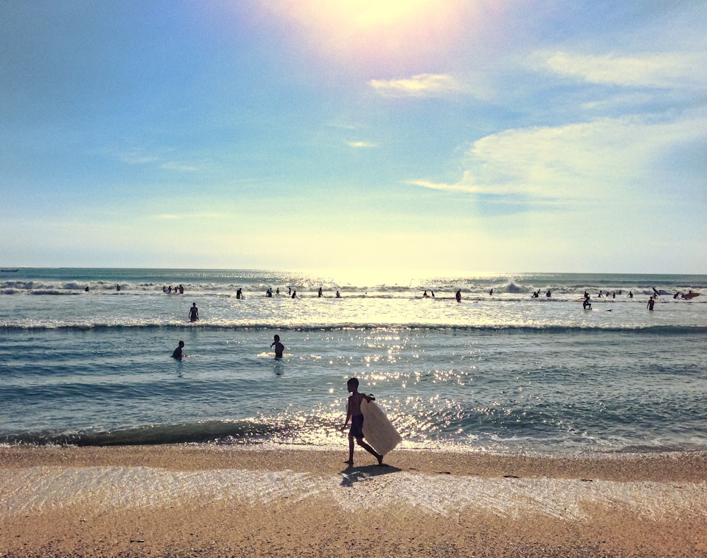 people on beach during daytime