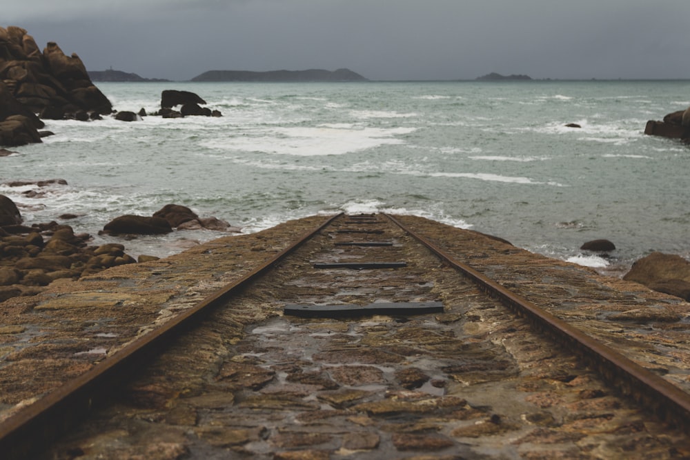 brown wooden dock on sea during daytime