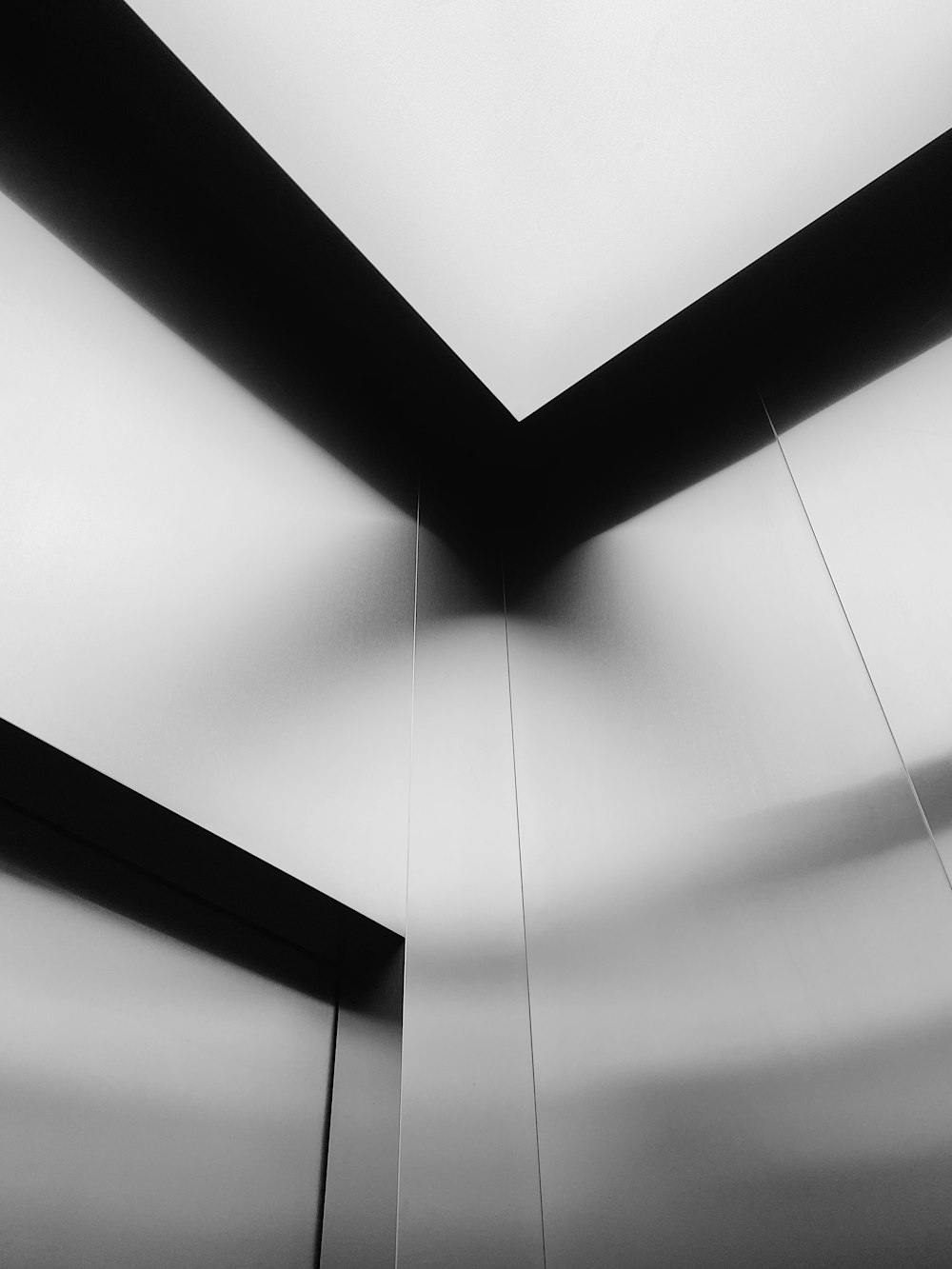grayscale photo of square ceiling