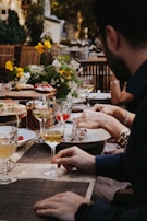 A vibrant outdoor event with guests enjoying a meal.