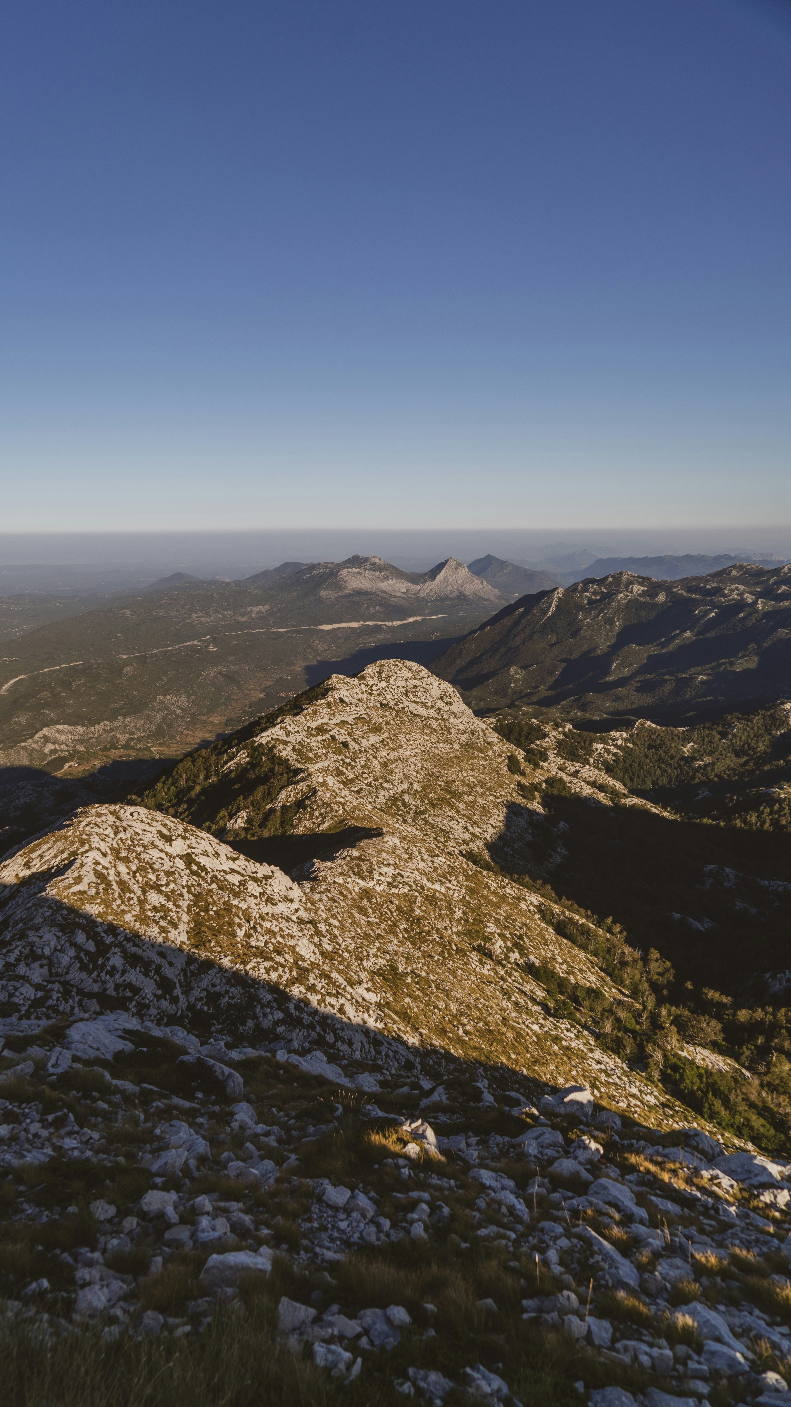brown rocky mountain under blue sky during daytime
