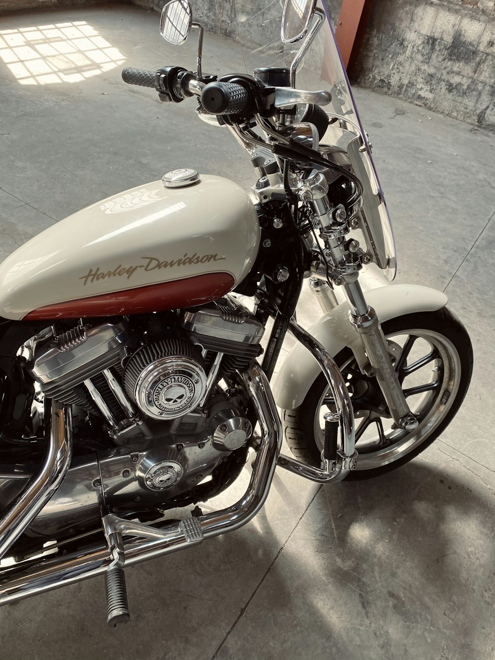 red and silver cruiser motorcycle