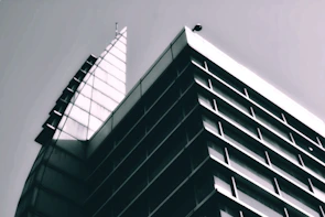 Sleek architectural facade featuring monochrome colors and sharp angles.