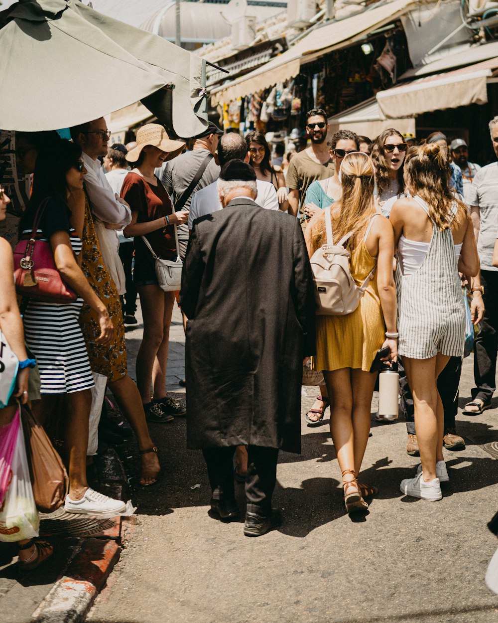 group of people walking on street during daytime