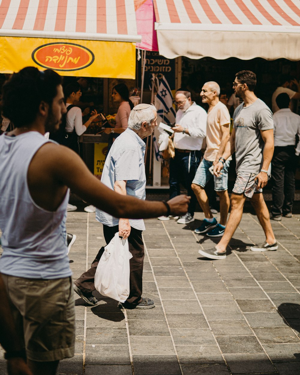 people gathering on a street during daytime