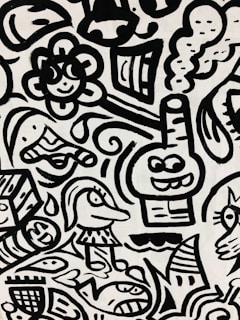 A black and white abstract pattern features cartoon-like characters and playful shapes. Among these are a smiling flower, a fish, a whimsical face with a hat, and a box with facial features. Curved lines and swirls interweave to create a dynamic composition.