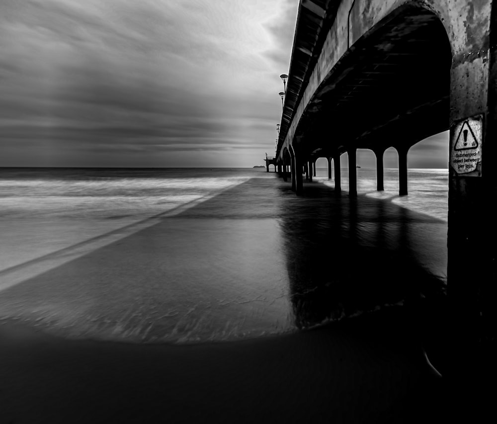 grayscale photo of a beach