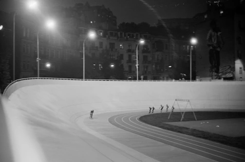 Night event at Ruckstrack with colorful lights and BMX riders performing stunts