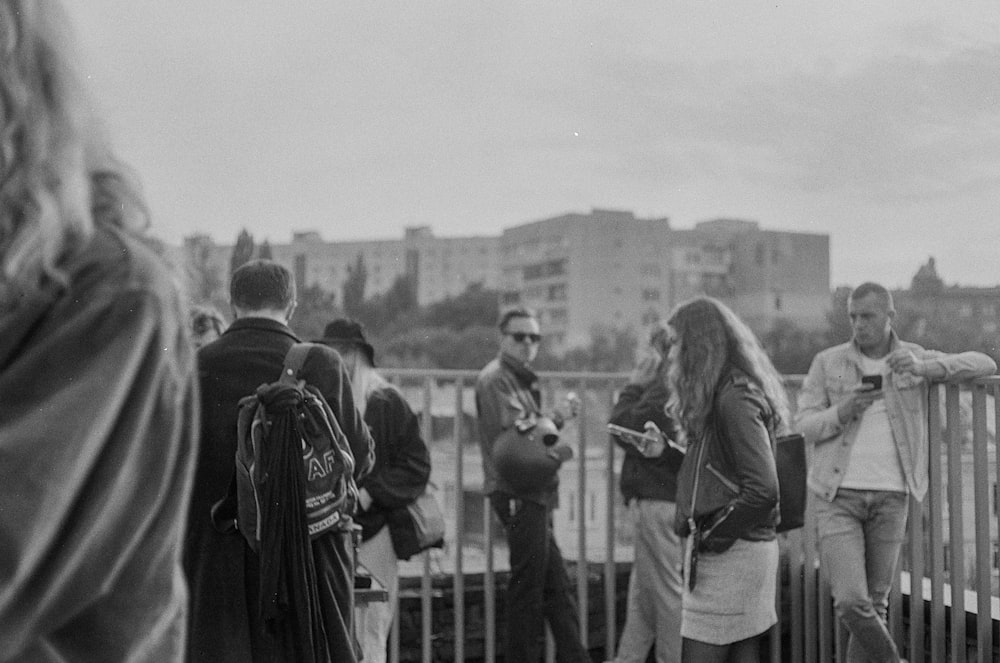 grayscale photo of people walking on the street