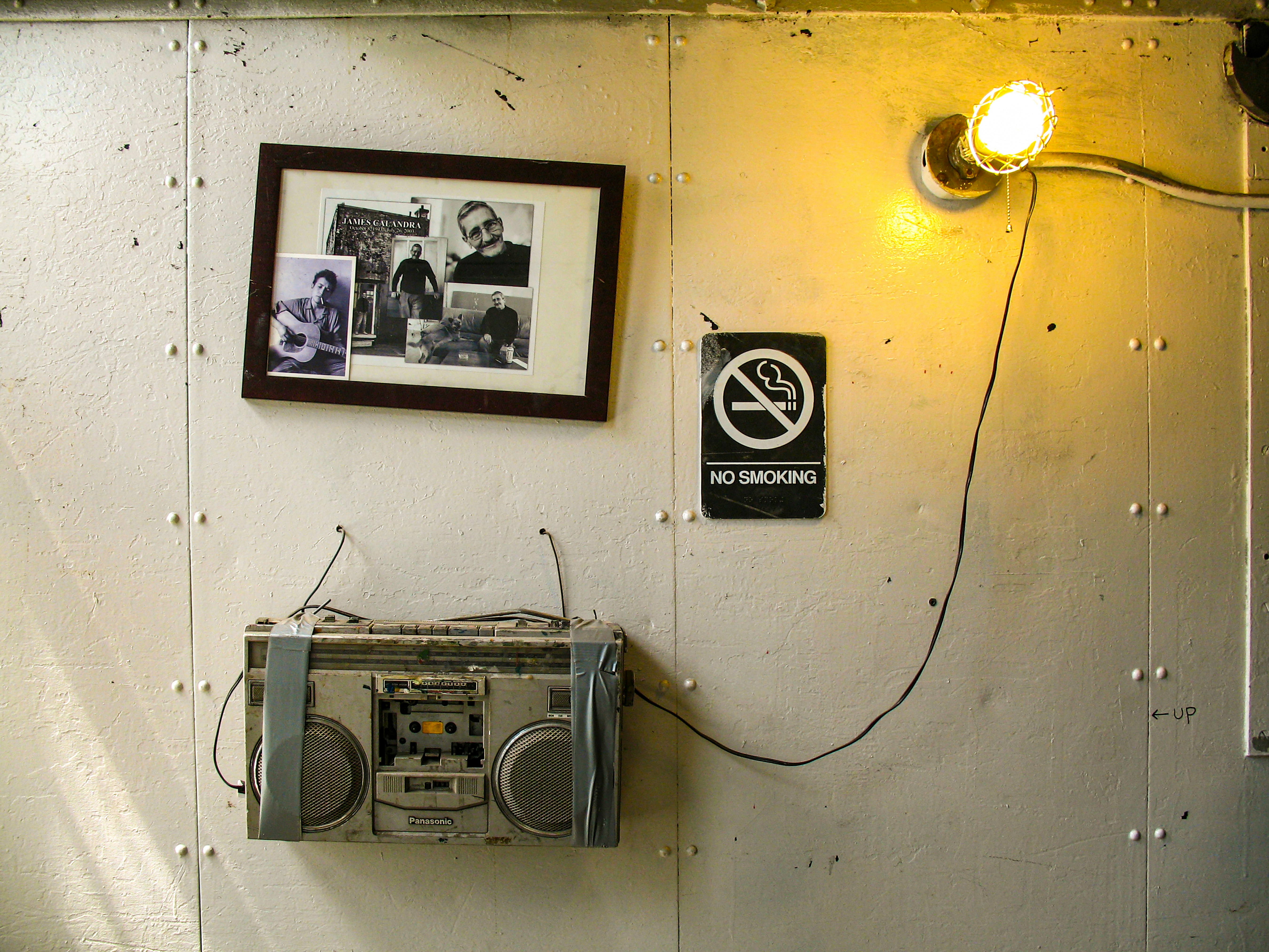 gray and black radio on white wall