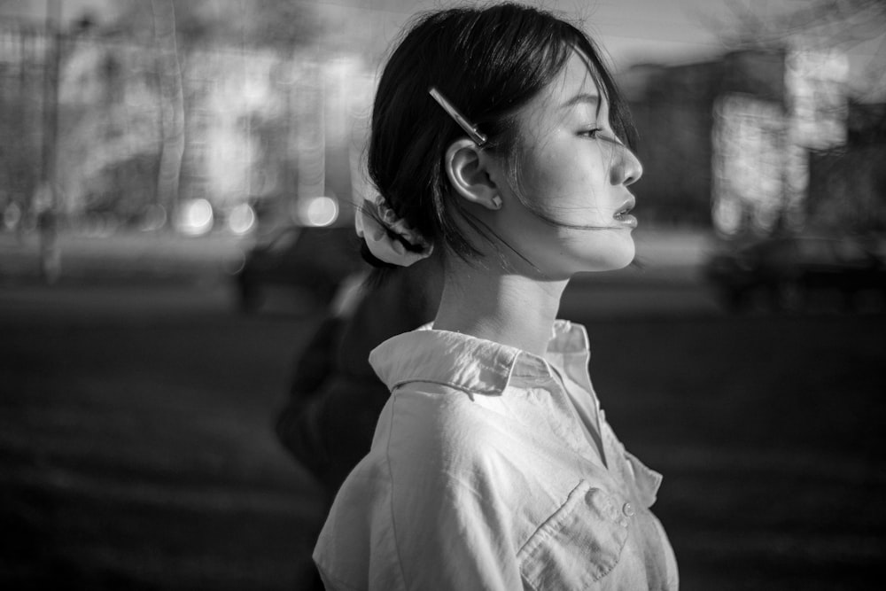 grayscale photo of girl in white shirt