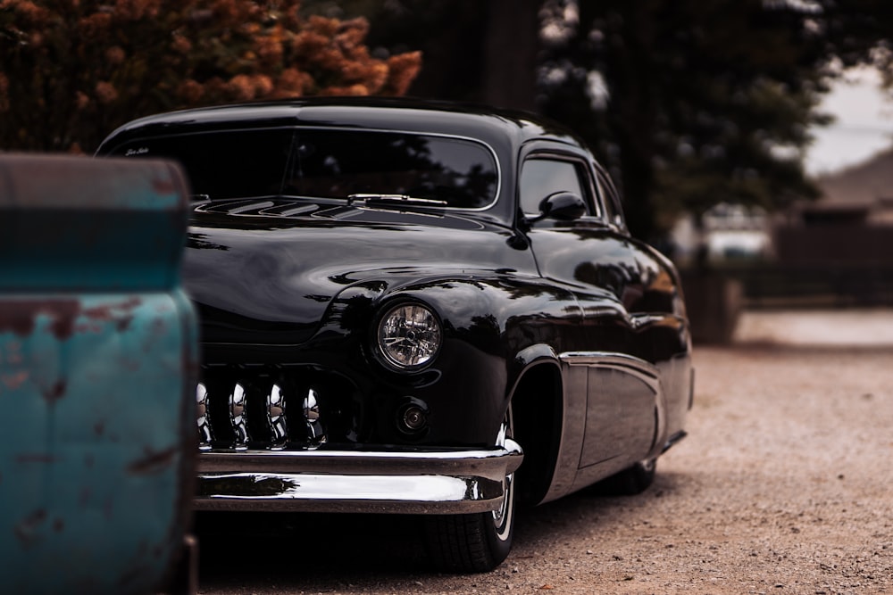 black vintage car on road during daytime