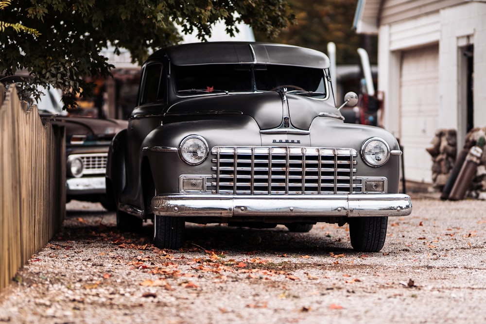 black vintage car on brown soil