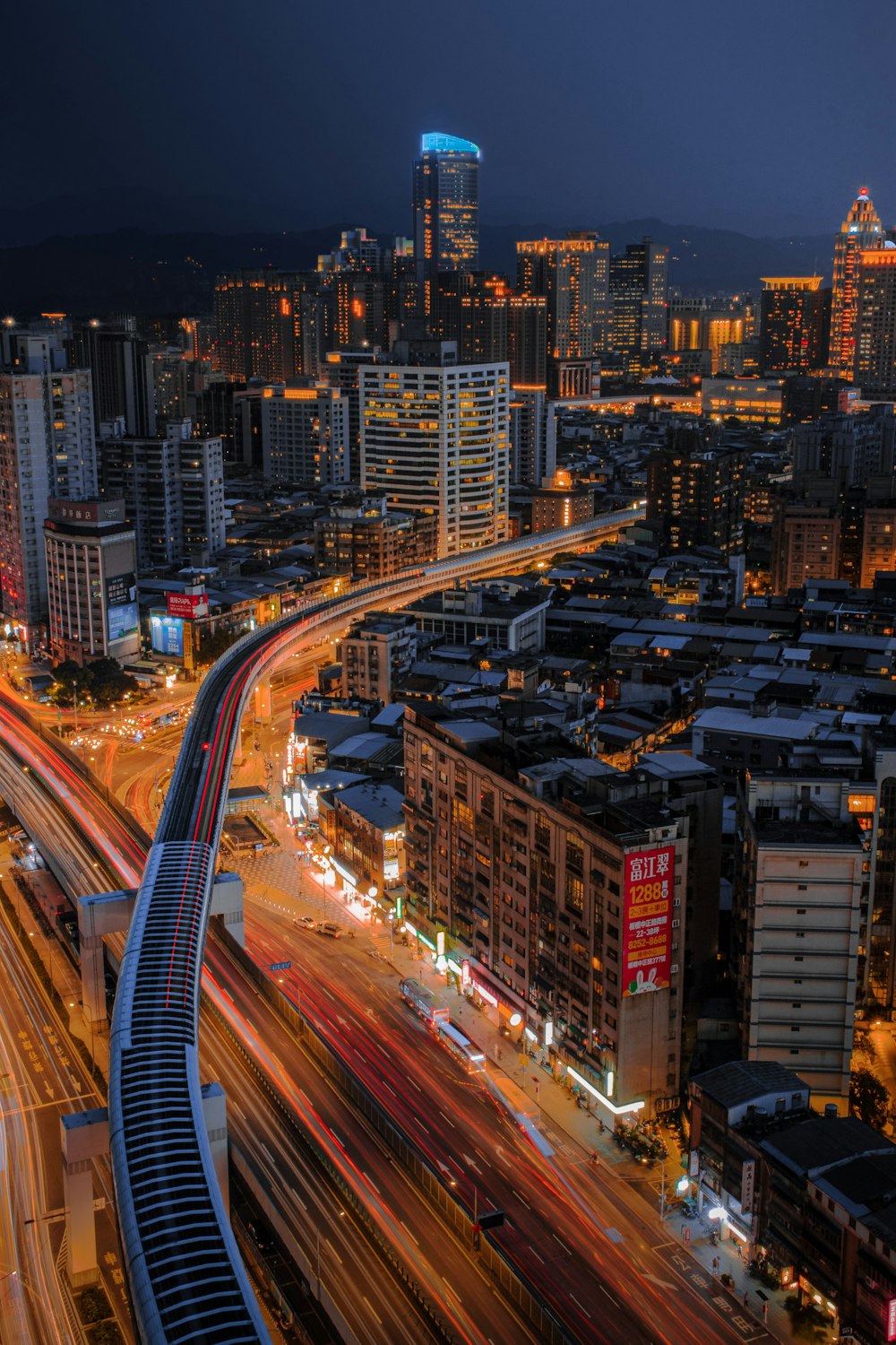 city with high rise buildings during night time