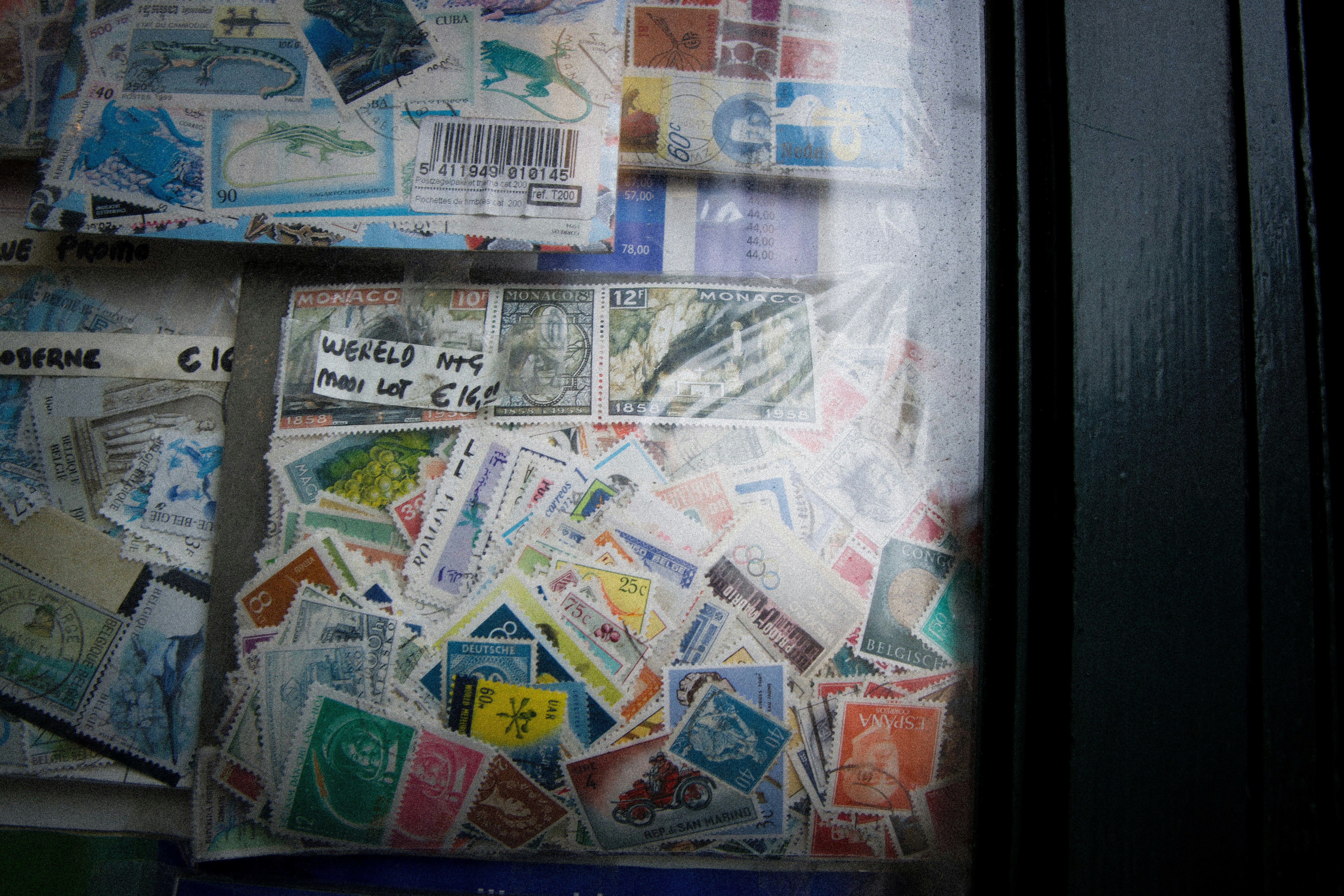 chaotic stamp collection behind store window