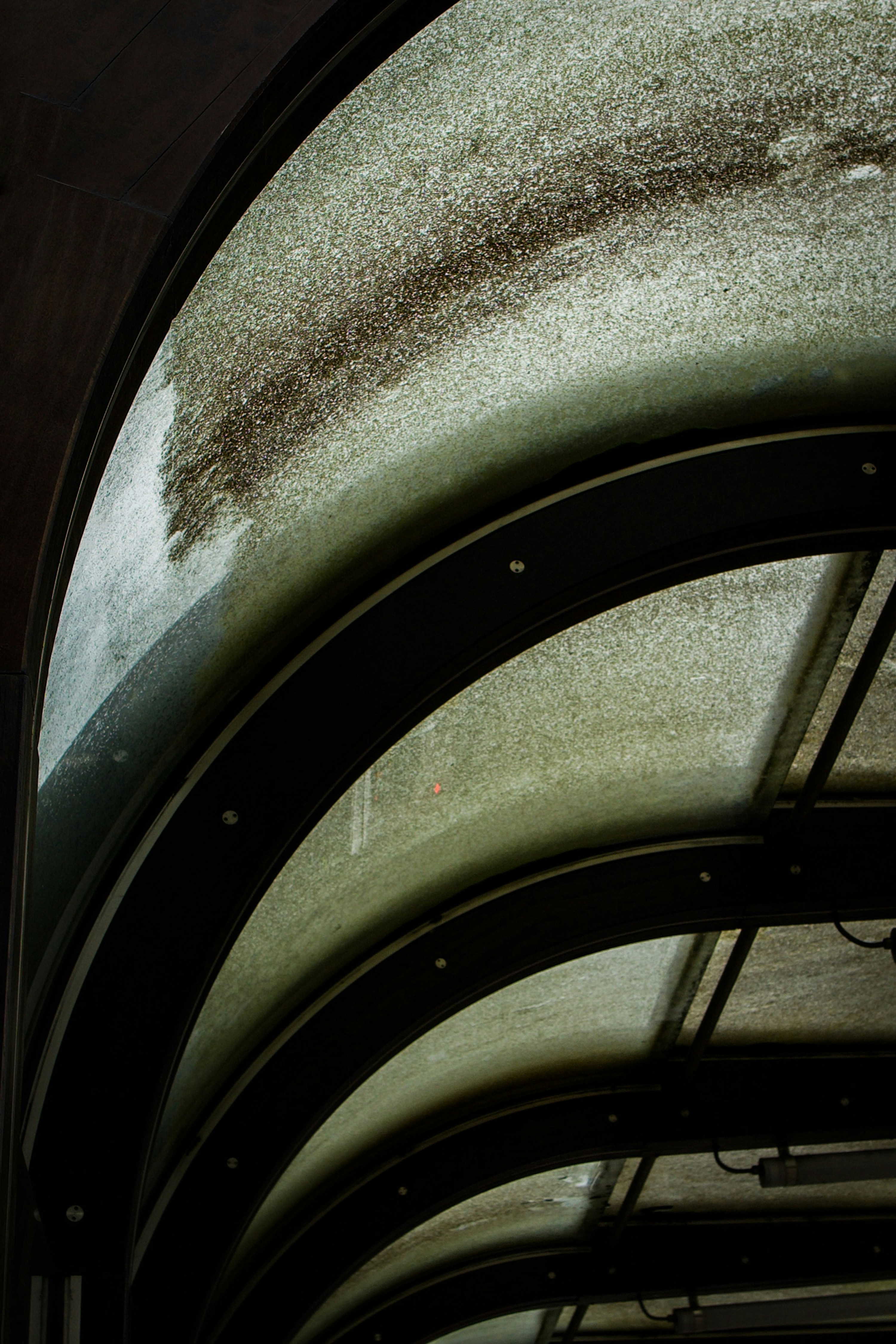 Retro vintage architecture (curved and dirty roof) at a tram station in Ghent