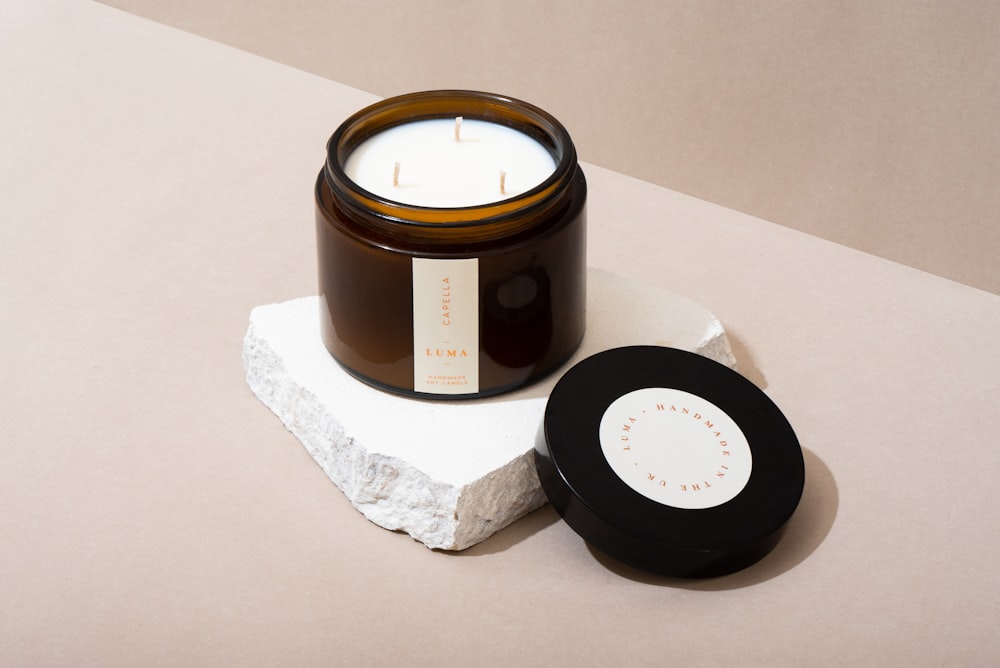 black round container on white tissue paper