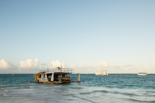 white and brown boat on sea during daytime in Punta Cana Dominican Republic