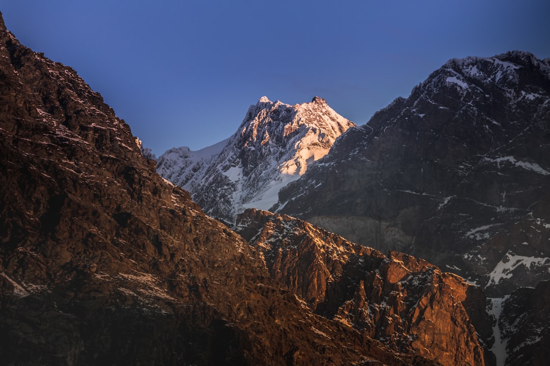 brown and white rocky mountain under blue sky during daytime