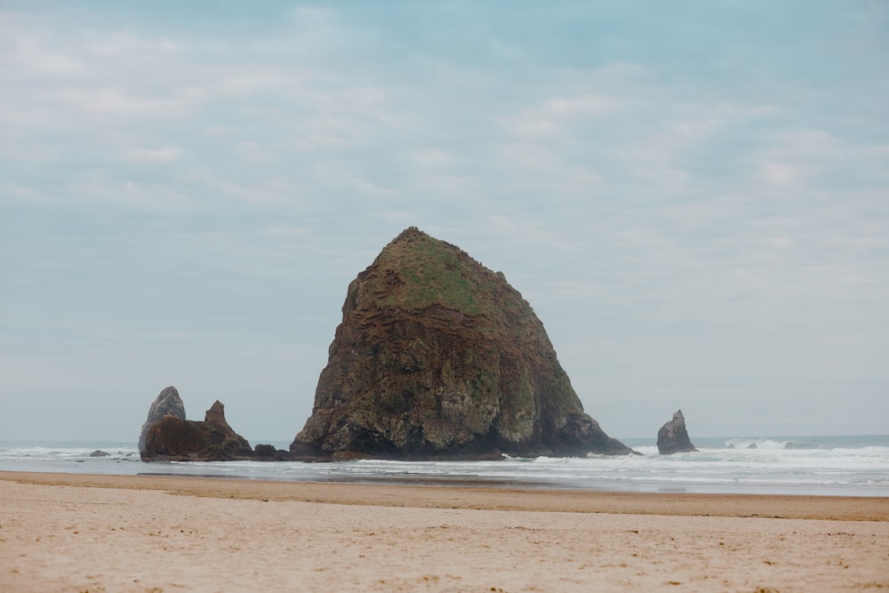 brown rock formation on sea shore during daytime