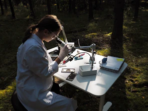 Scientist explaining microbiological results to a farmer in a field setting.