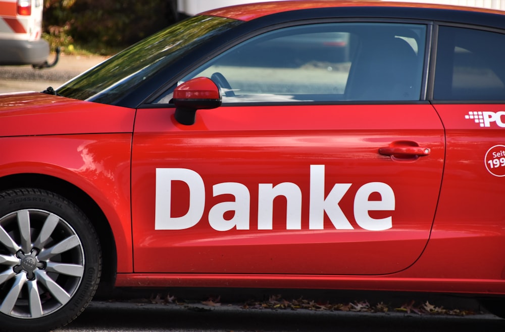 red and white car on road