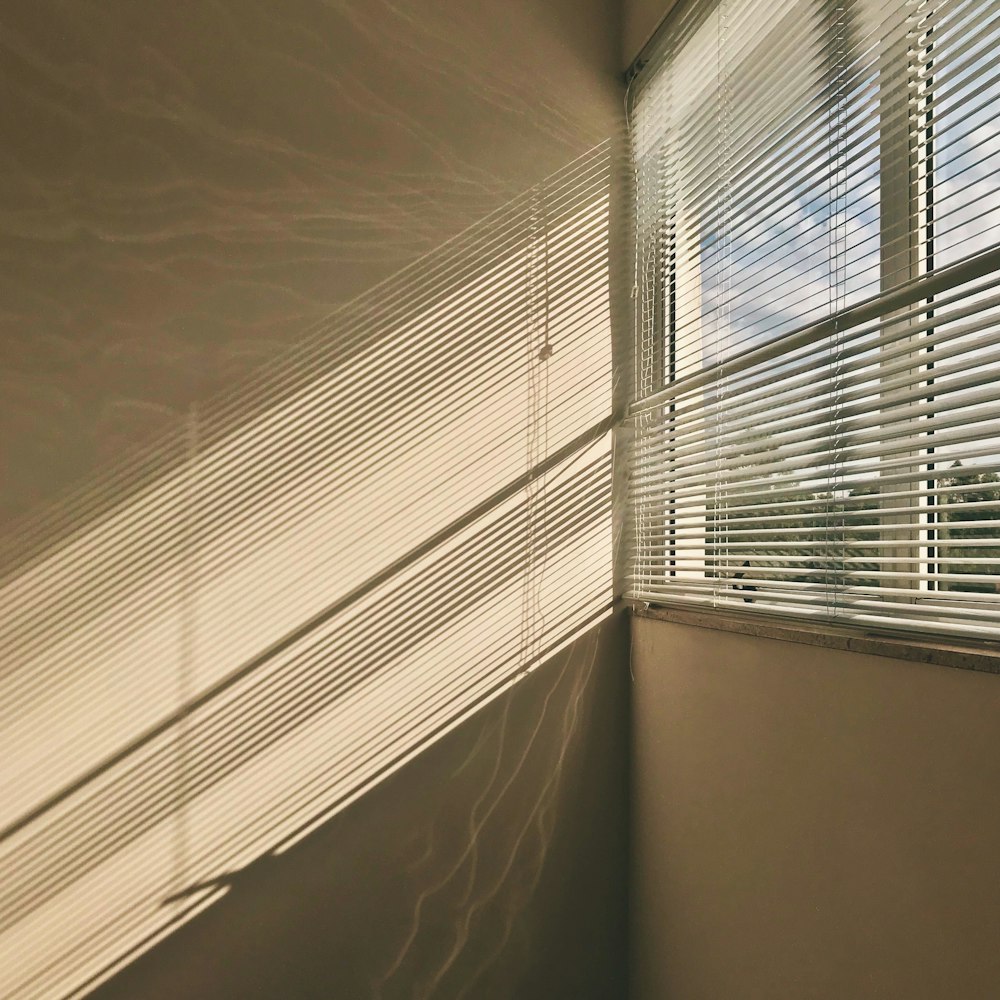 white window blinds on window