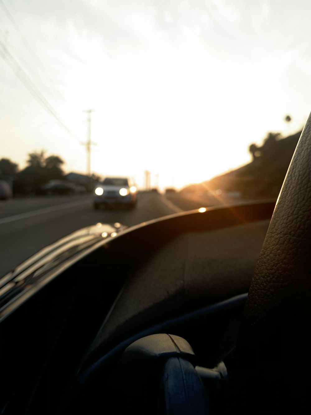 car on road during sunset