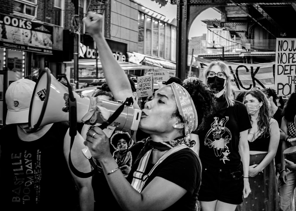 grayscale photo of woman in black t-shirt and black sunglasses