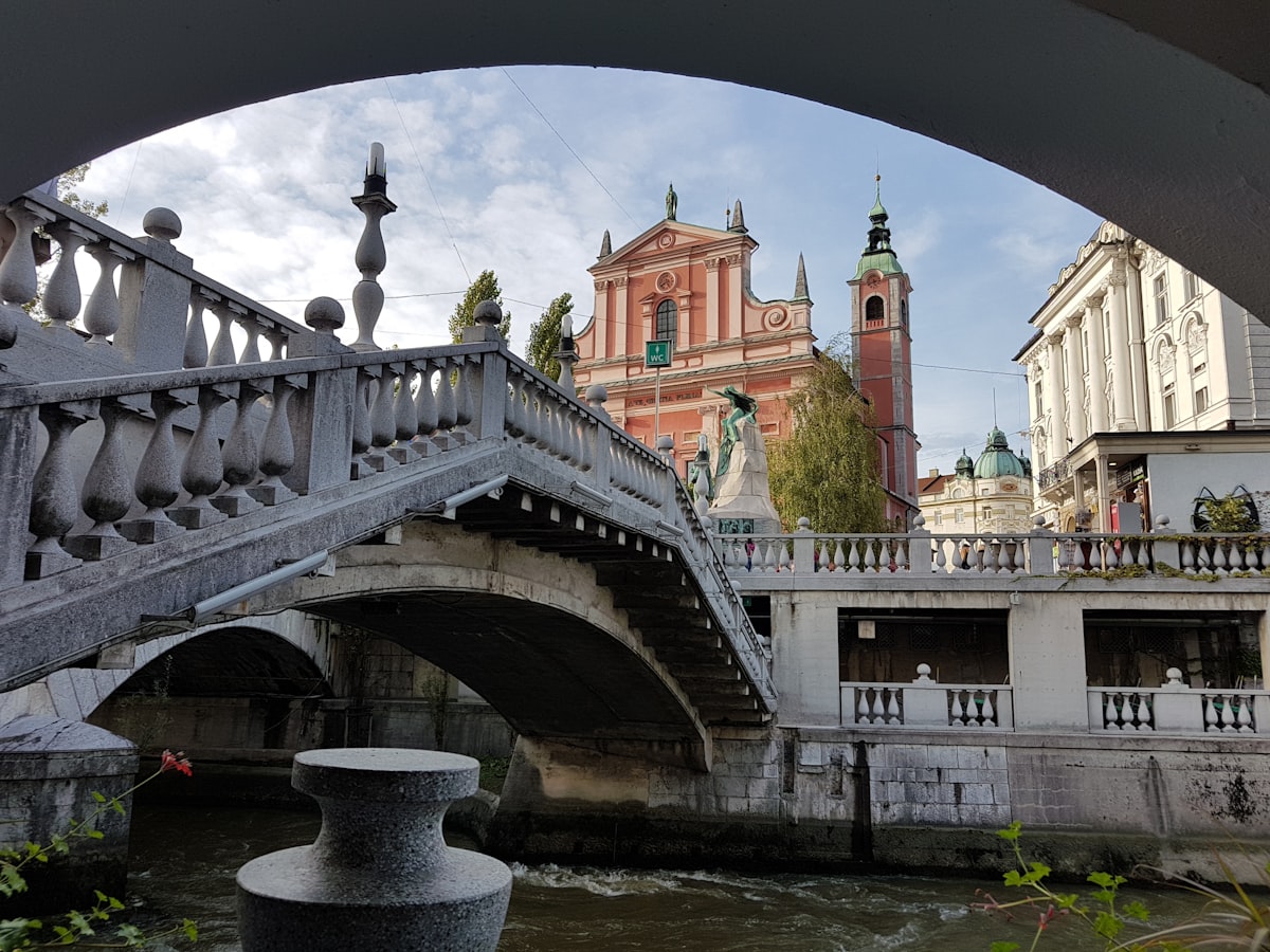 The Triple Bridge and pink Franciscan Church in central Ljubljana, Slovenia