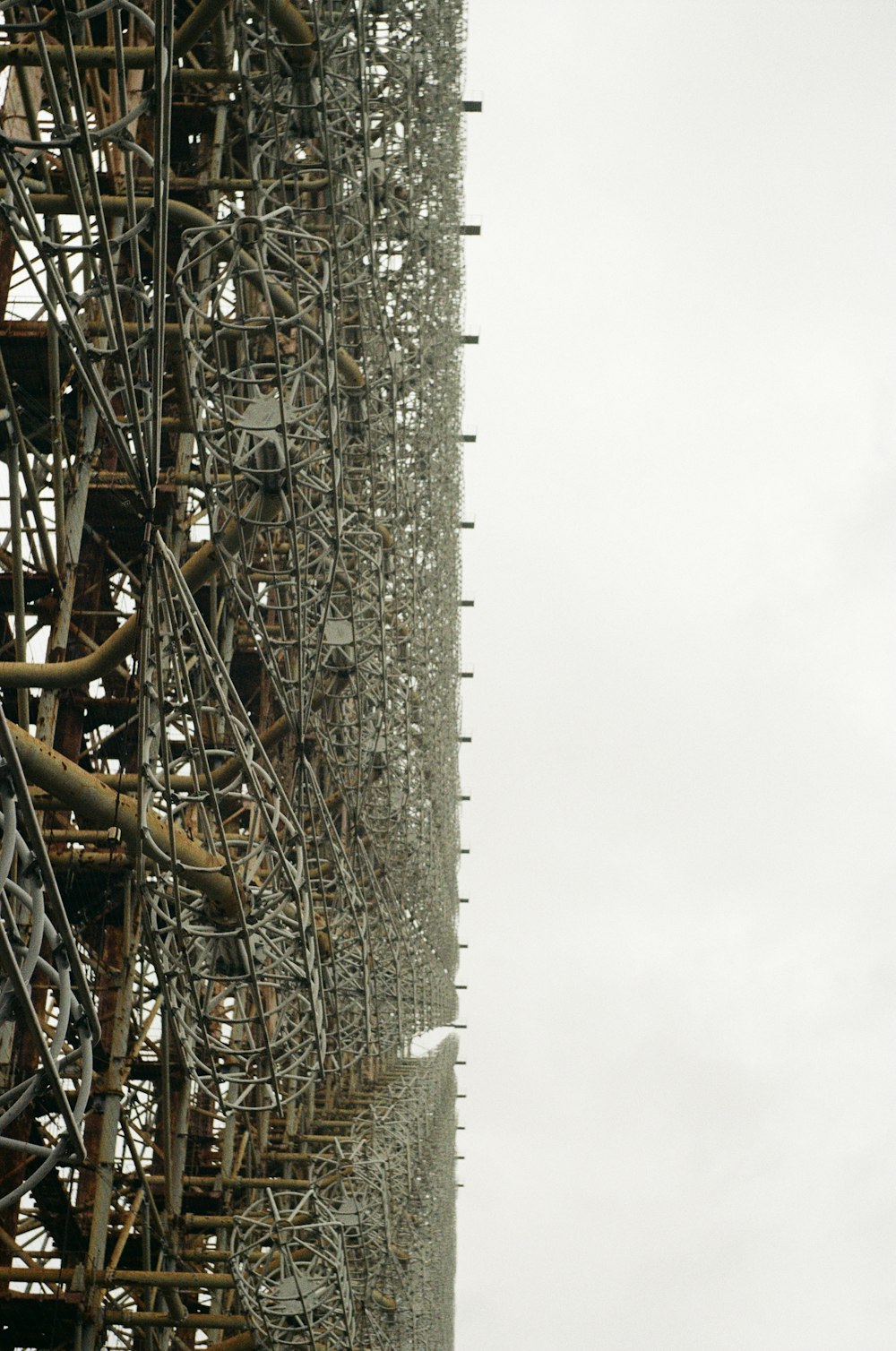 brown metal tower under white sky during daytime