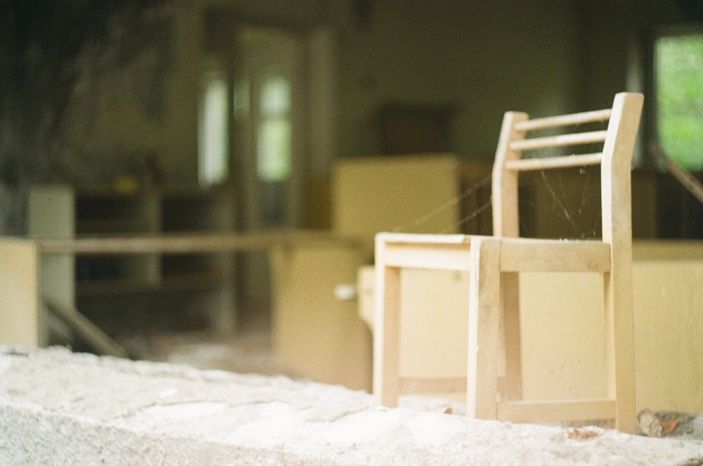 white wooden chair on white snow