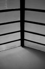 Minimalist black and white photo of a serene Japanese-style office space with bamboo accents.