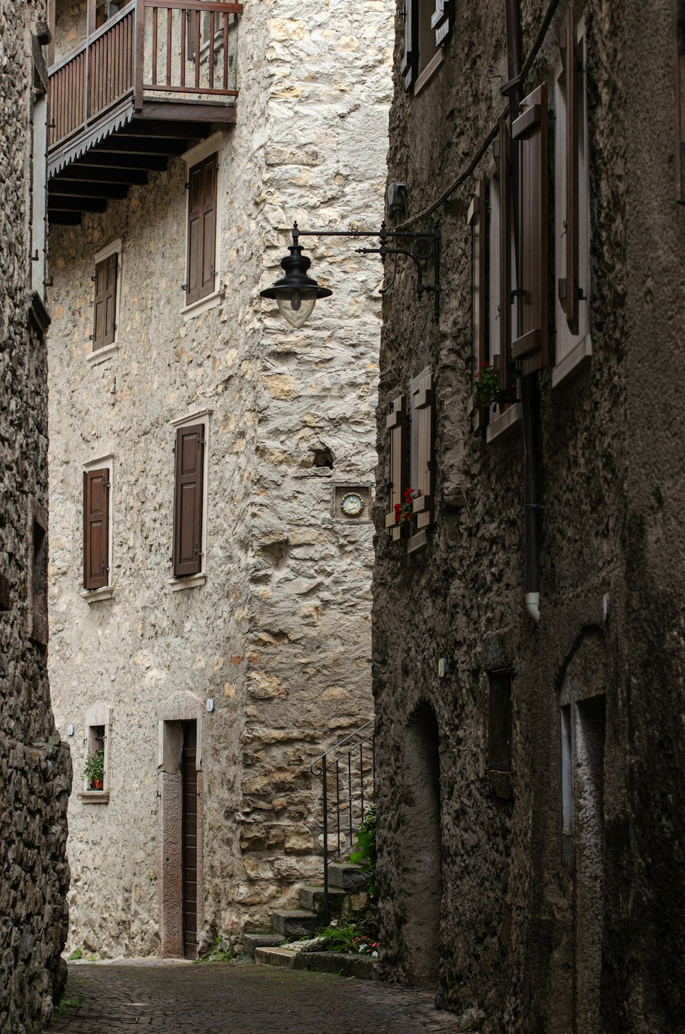 brown brick building with black sconce