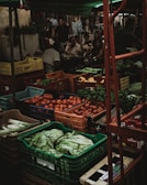 red apples on green plastic crate