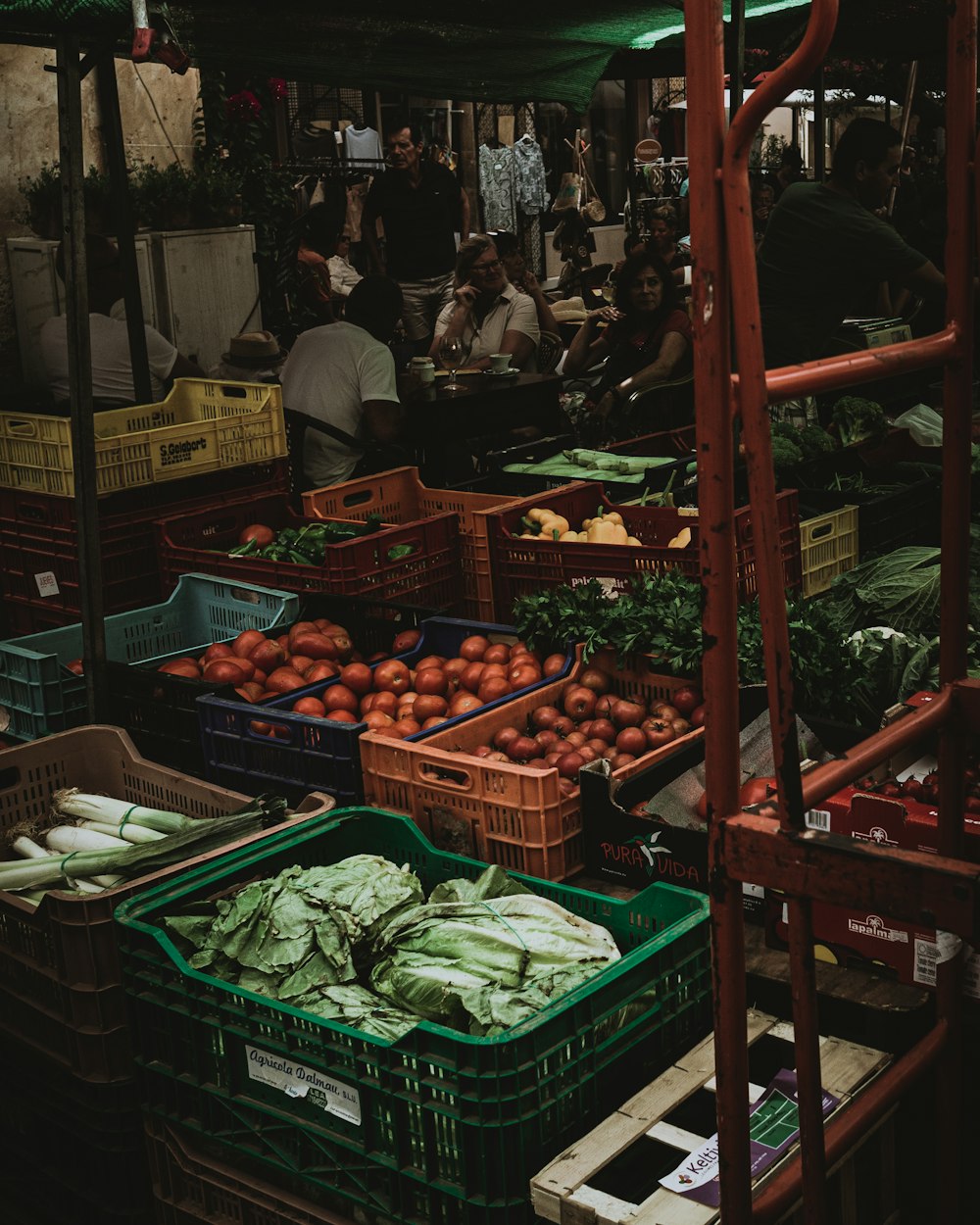 red apples on green plastic crate