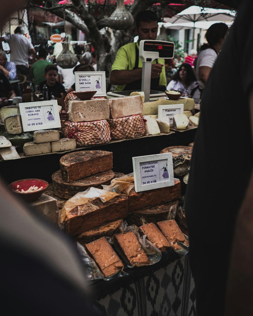 people standing in front of food stall during daytime