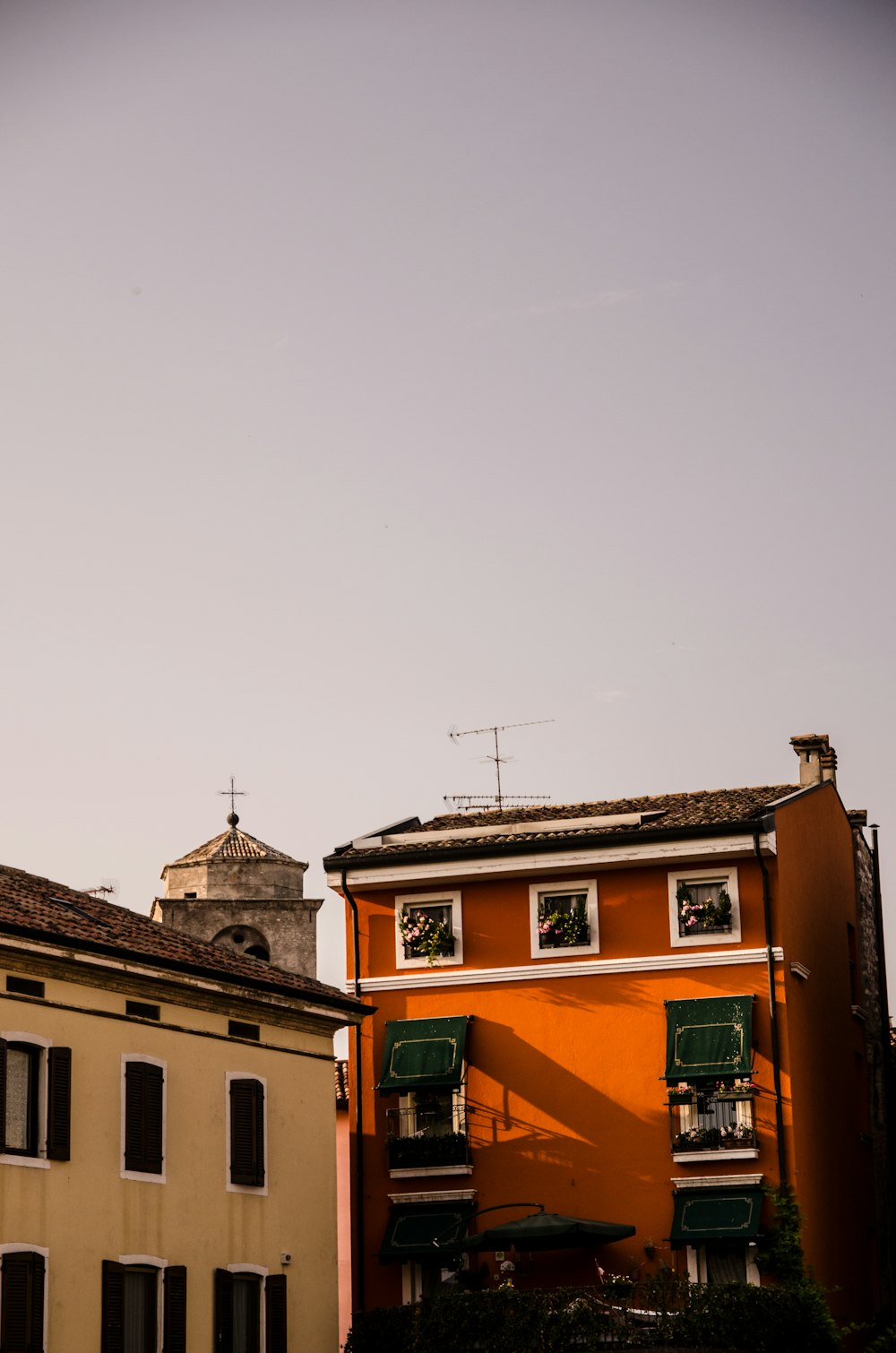 brown concrete building under white sky during daytime