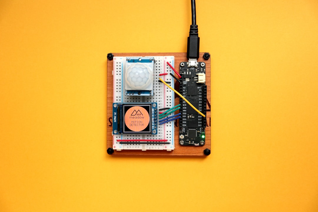 green and white circuit board, Meadow F7 Micro connected to Motion Sensor