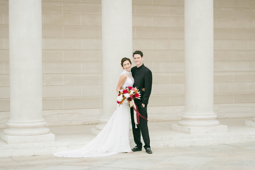 bride and groom standing on white floor