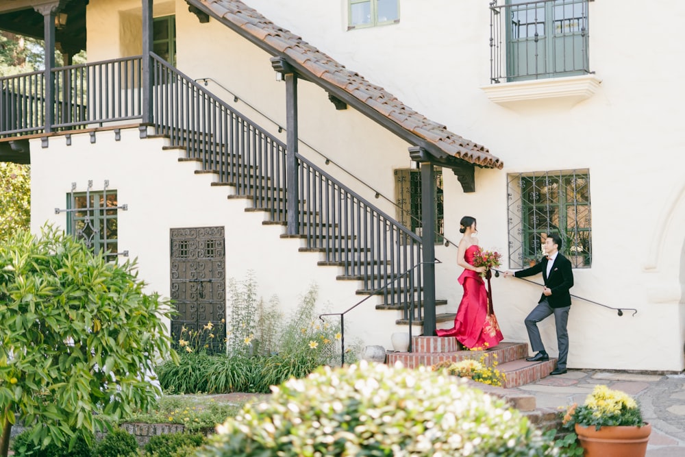 man and woman walking on the stairs