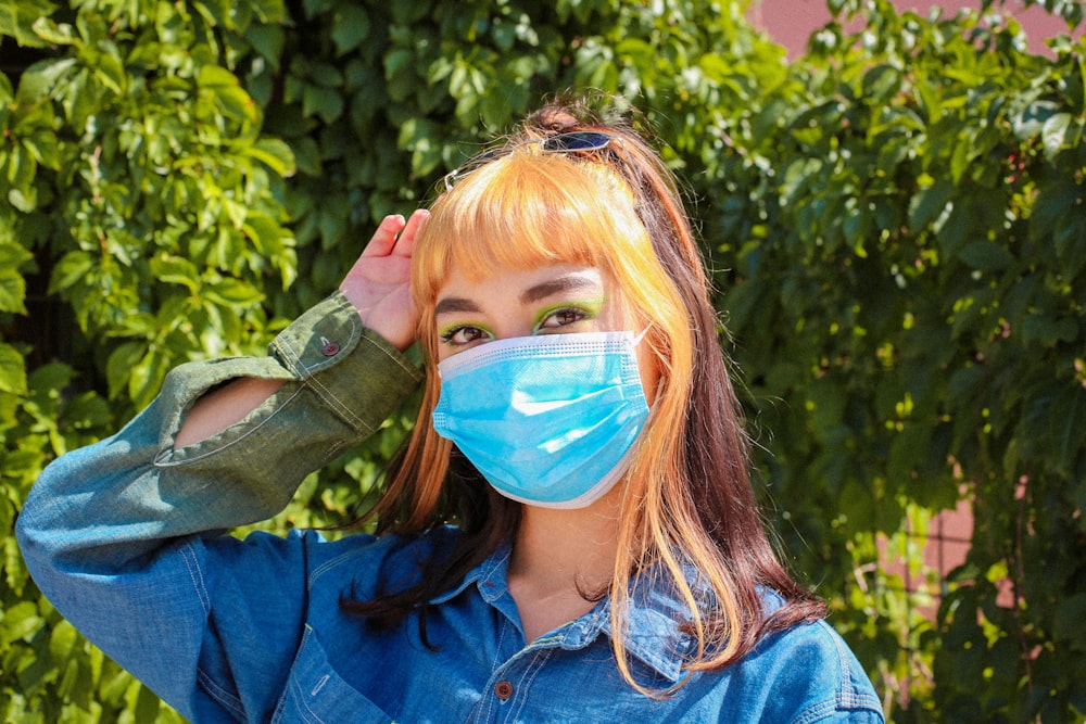 girl in blue denim jacket with blue face paint