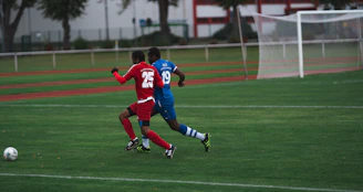man in red and blue football jersey shirt