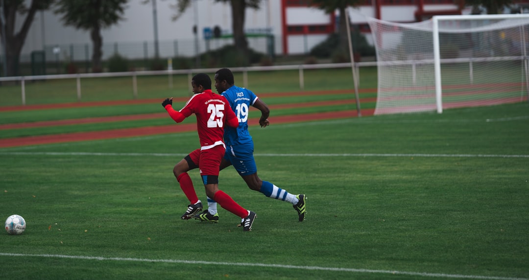 man in red and blue football jersey shirt