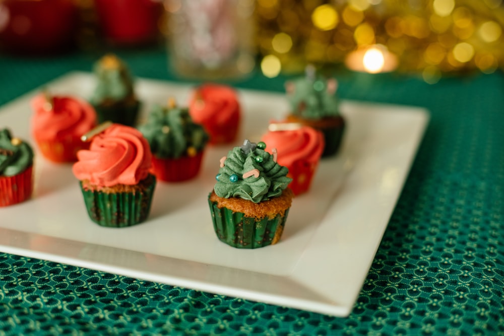 red and green cupcake on white table