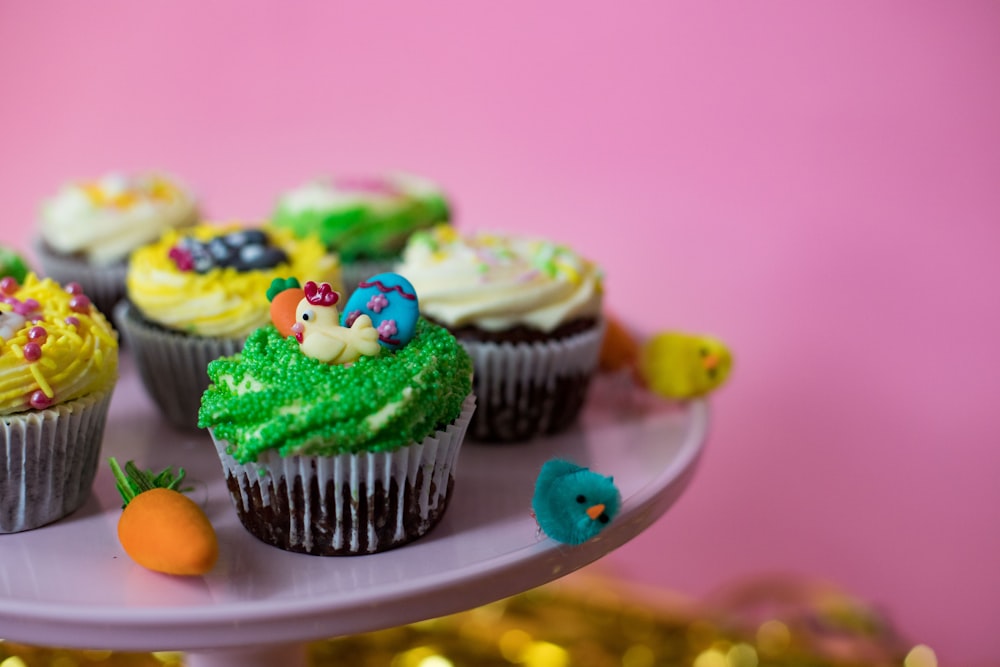 green cupcake with green icing on white ceramic plate