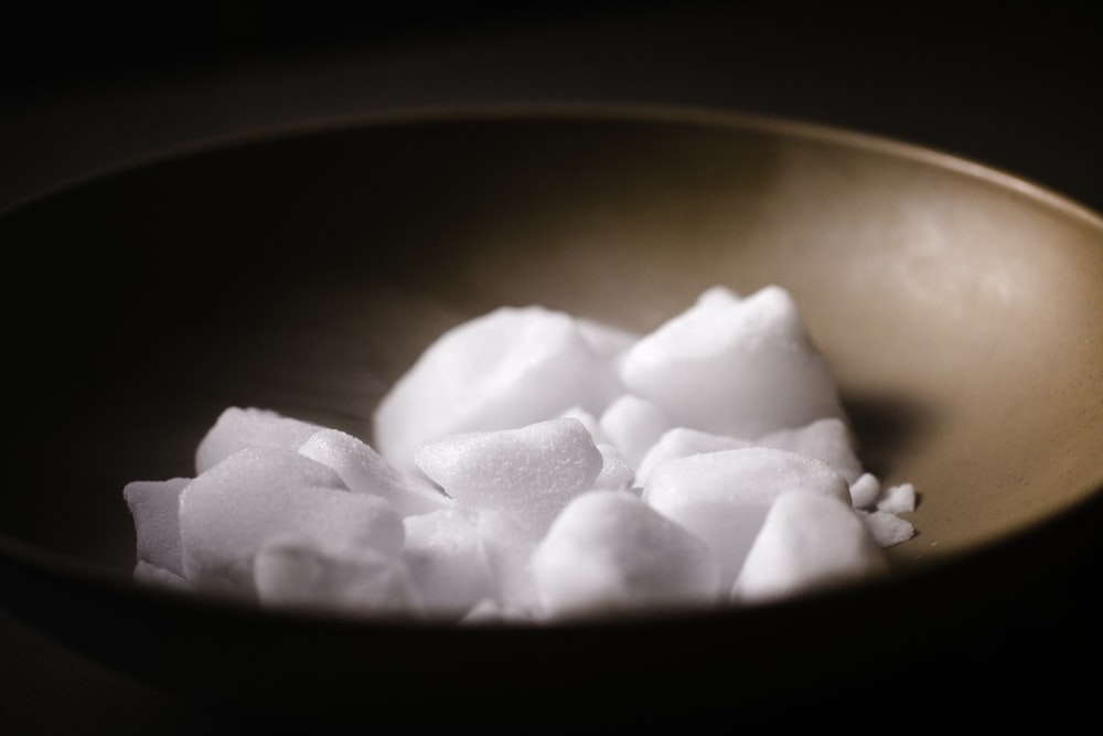 white sugar on gray bowl